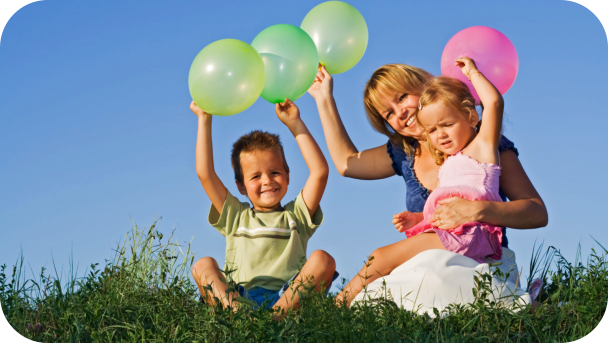 a teacher and kids playing balloon